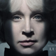 Gwendoline Christie in a stylized, almost black-and-white character portrait as Lucifer in Netflix's Sandman.